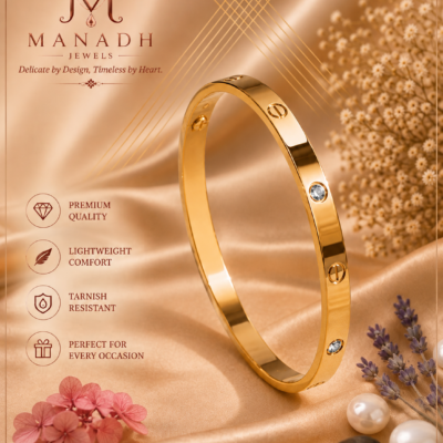 Gold-tone polished bangle with circular detailing and sparkling crystal accents