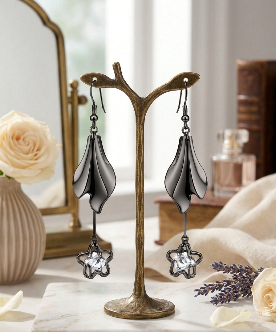 Gunmetal Sculpted Petal Star Crystal Earrings 2 Luxury silver designer drop earrings for women by MANADH Jewels showcased on a female model wearing an elegant emerald green saree in a premium jewelry catalogue with warm editorial lighting