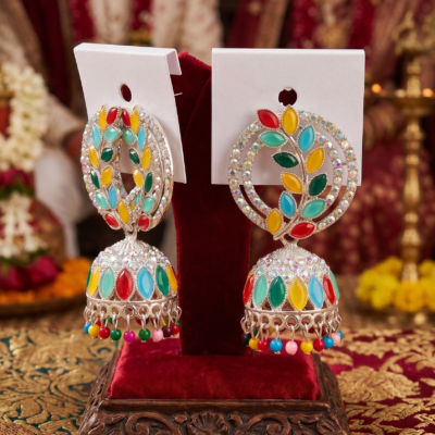 Premium multicolor oxidized jhumka earrings featuring colorful stone embellishments, intricate silver detailing, and decorative hanging beads displayed by Manadh Jewels
