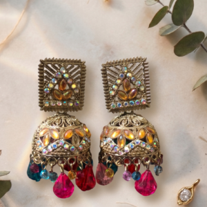 Pink stone oxidized statement earrings featuring crystal embellishments and dangling pink bead drops by Manadh Jewels for festive, wedding, and traditional ethnic wear