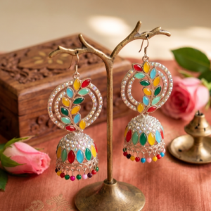 Premium multicolor oxidized jhumka earrings featuring colorful stone embellishments, intricate silver detailing, and decorative hanging beads displayed by Manadh Jewels