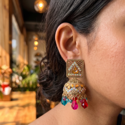 Pink stone oxidized statement earrings featuring crystal embellishments and dangling pink bead drops by Manadh Jewels for festive, wedding, and traditional ethnic wear