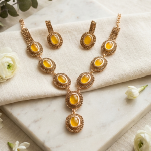 MANADH JEWELS yellow stone necklace set with matching earrings in gold-tone finish