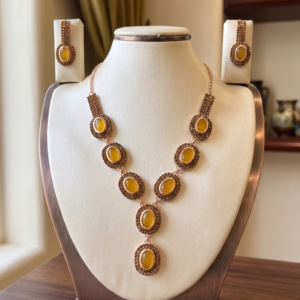 MANADH JEWELS yellow stone necklace set with matching earrings in gold-tone finish