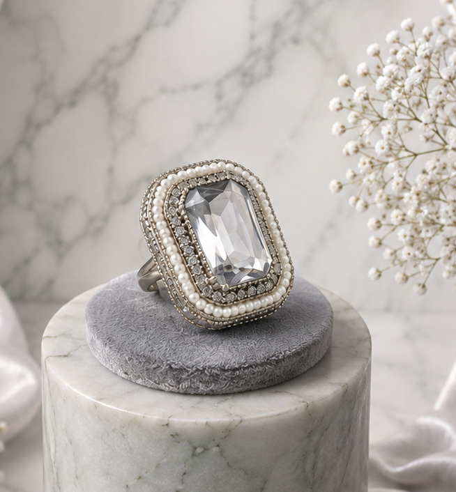 Silver Crystal Statement Ring 1 Silver statement ring by Manadh Jewels featuring a large emerald-cut clear crystal in a vintage-inspired rectangular setting, displayed in front, side, back, and angle 360-degree views.