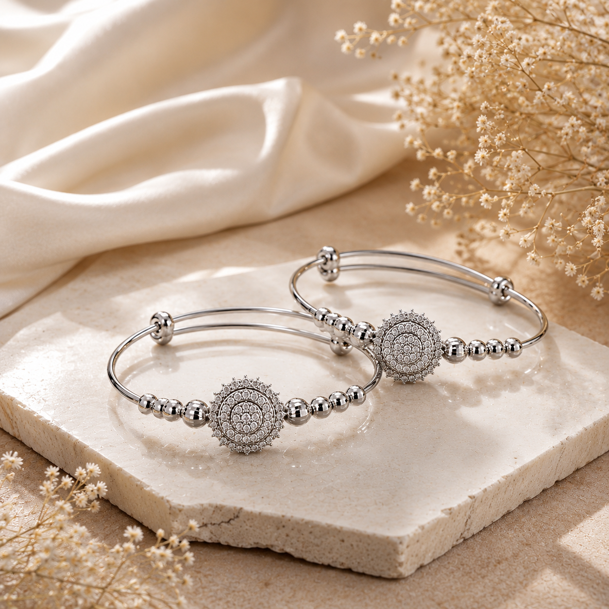 Sliver Floral Kada MND-BR011 Slide1 Silver-toned designer bangle set with intricate circular motifs and polished bead detailing