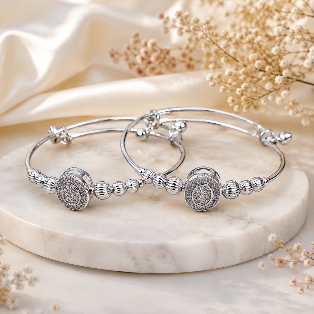 Sliver Kada MND-BR010 Slide1 Silver-toned embellished bangle set with circular centre motifs and polished bead detailing