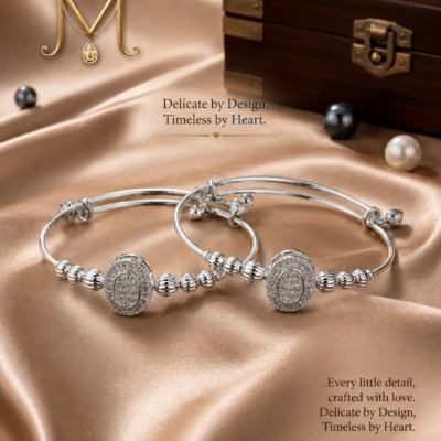 Silver-toned embellished bangle set with circular centre motifs and polished bead detailing