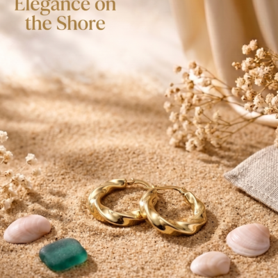 Twisted gold hoop earrings by Manadh Jewels crafted from premium stainless steel with a polished gold finish, displayed on a marble platform in an elegant luxury setting