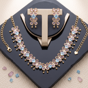 Gold-toned lightweight jewelry set by Manadh Jewels featuring a necklace and matching earrings with pink butterfly motifs and clear American diamond stones