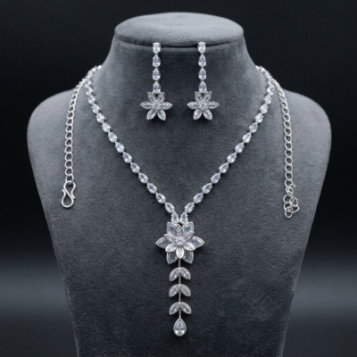 Lightweight silver crystal latkan necklace set on clear card packaging with adjustable link chain