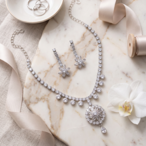 Elegant silver crystal floral necklace set with matching drop earrings