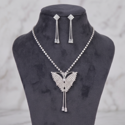 Radiant butterfly necklace and matching drop earrings with sparkling clear crystal-style stones by Manadh Jewels