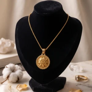 gold tone floral medallion pendant necklace featuring intricate filigree work