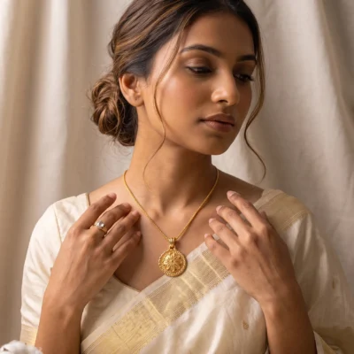 gold tone floral medallion pendant necklace featuring intricate filigree work