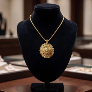 Gold filigree pendant necklace with ornate round design