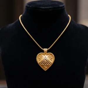 Gold heart pendant necklace with intricate floral openwork design