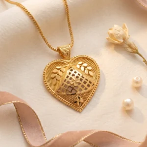 Gold heart pendant necklace with intricate floral openwork design