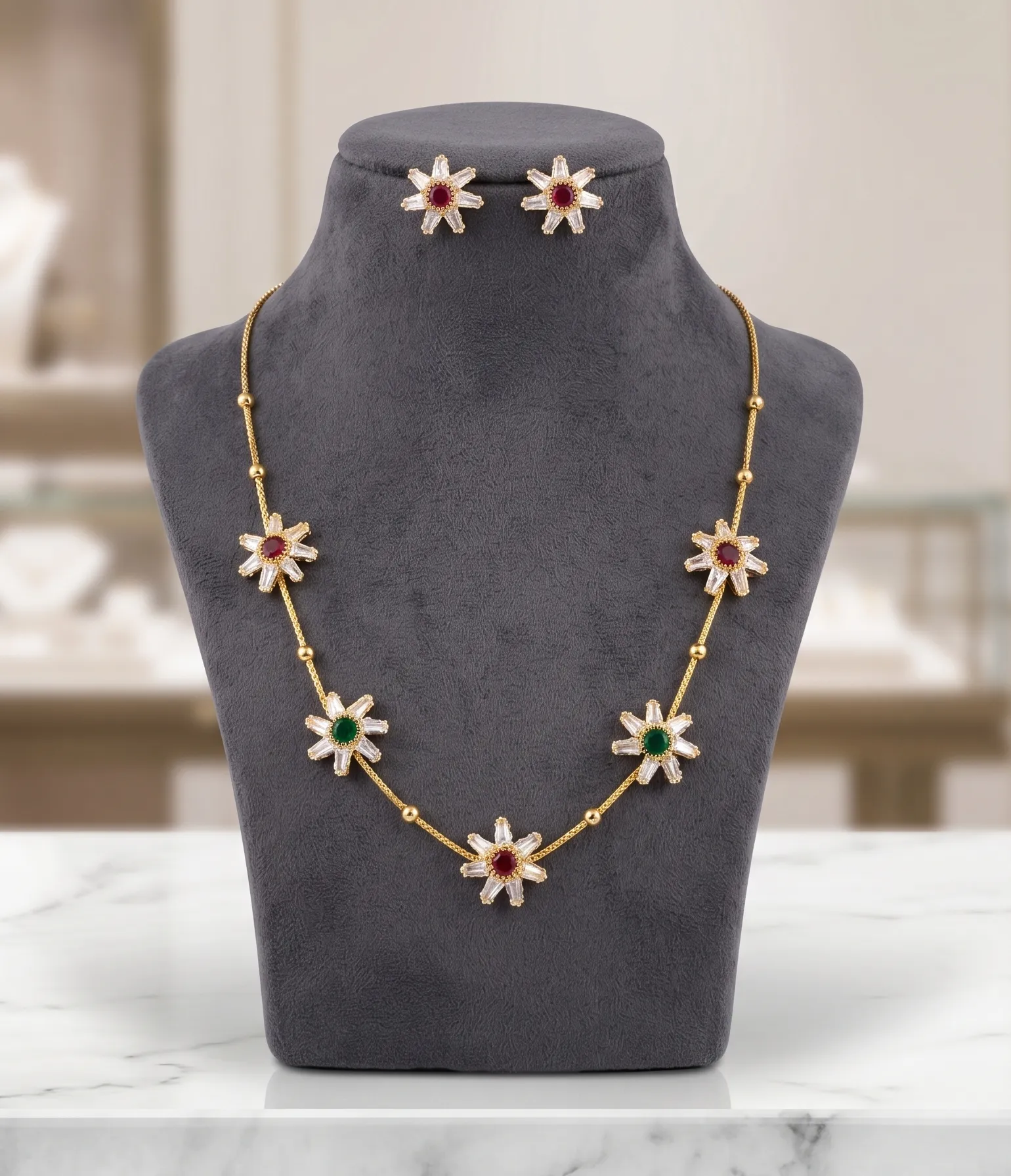 Floral Gold-Plated Necklace Set with Ruby &_ Emerald Color Stones 1 Gold-tone necklace set featuring floral pendants with white, red, and green stones alongside matching stud earrings