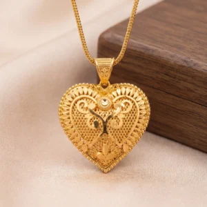 gold heart pendant necklace with intricate filigree design