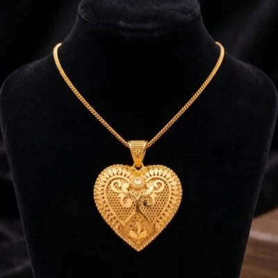 gold heart pendant necklace with intricate filigree design