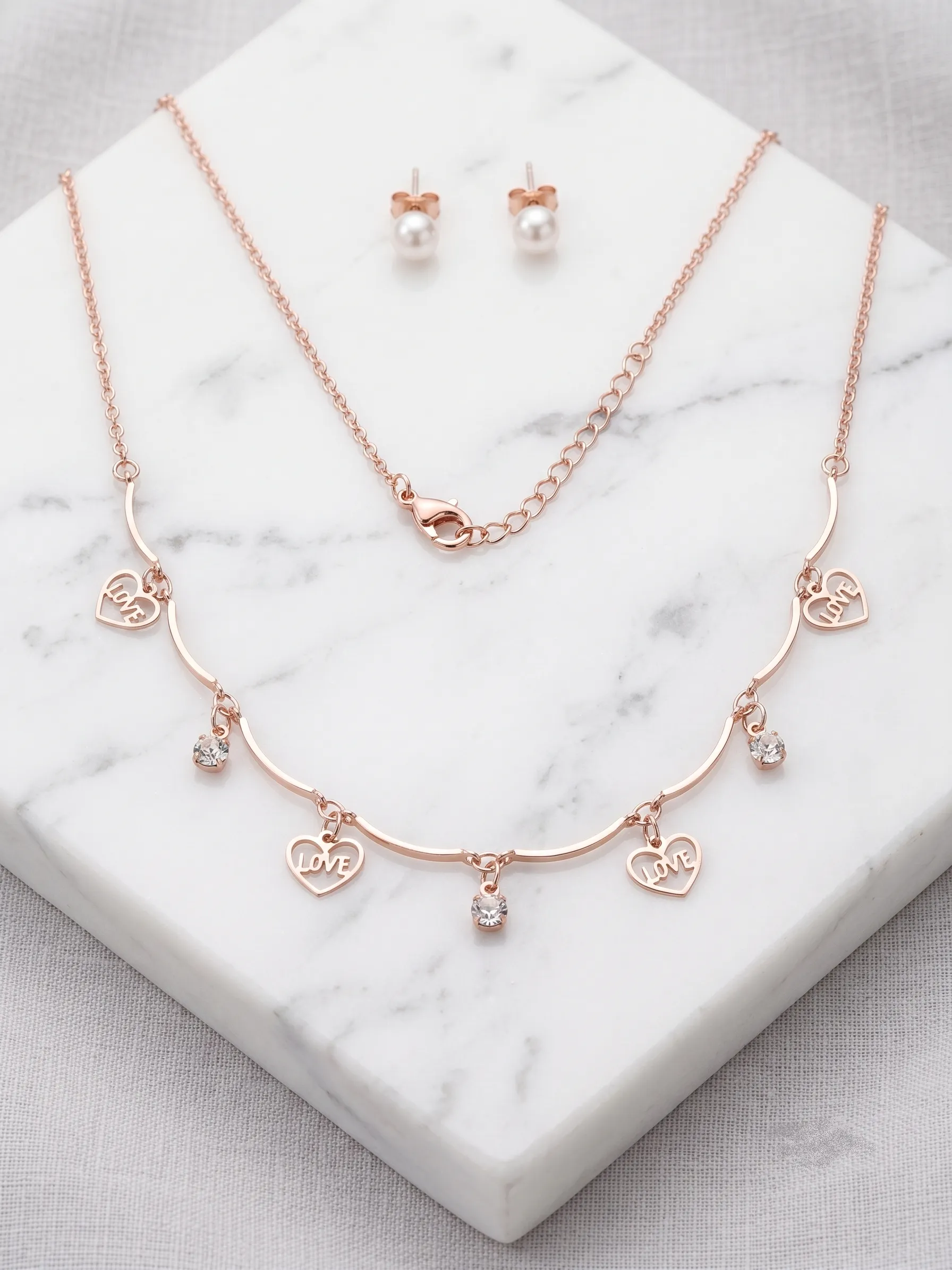 Rose Gold Love You & Heart Charm Necklace & Pearl Earring Set 2 Rose gold-tone necklace with heart charms reading LOVE and YOU alongside pearl stud earrings