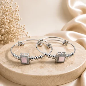 Silver adjustable kada bracelet with pink square gemstone and decorative silver beads