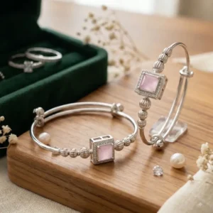 Silver adjustable kada bracelet with pink square gemstone and decorative silver beads